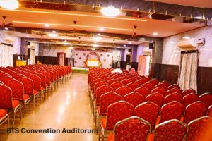 <img loading= title="Spacious and beautifully decorated AC banquet hall at BTS Conventions, Vijayawada – Perfect for weddings, parties, and formal functions"
